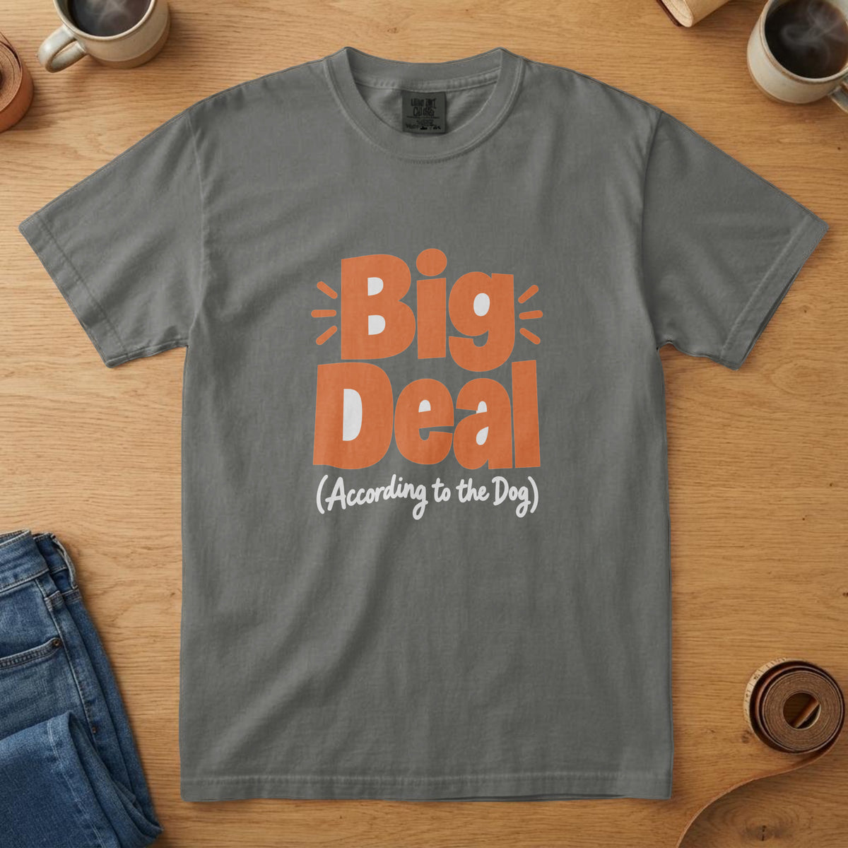 Pepper t-shirt with orange and white bold lettering reading "Big Deal (According to the Dog)"