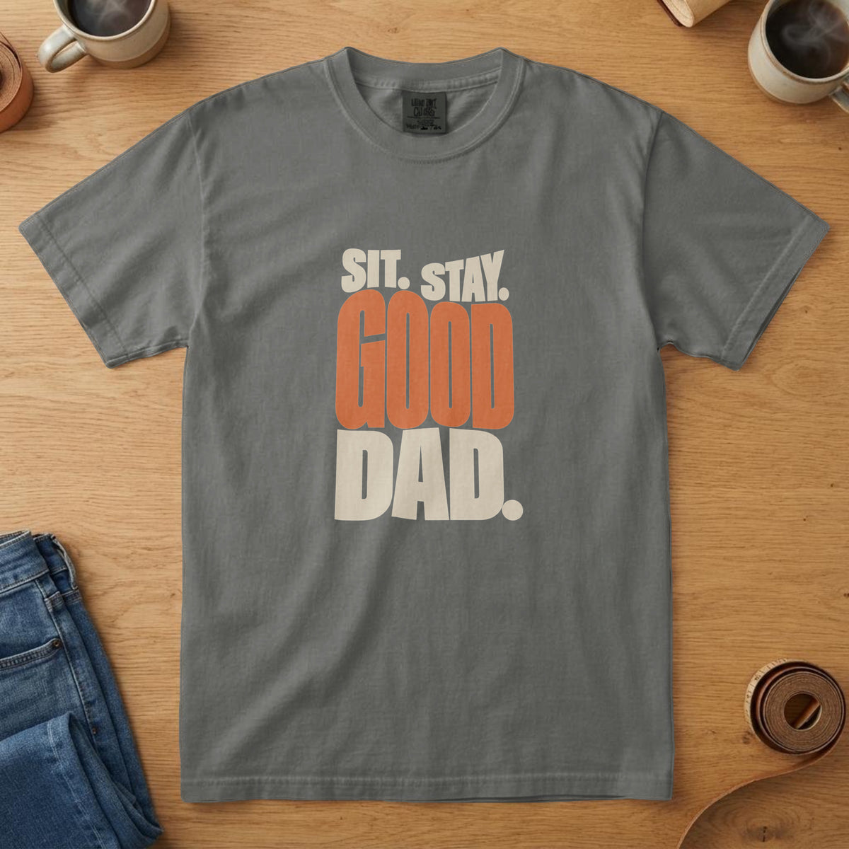 Pepper t-shirt with bone and orange bold stacked type reading "Sit. Stay. Good Dad."