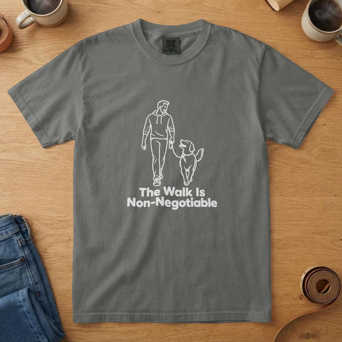 Pepper t-shirt with a white line drawing of a man and dog walking and the words "The Walk Is Non-Negotiable"
