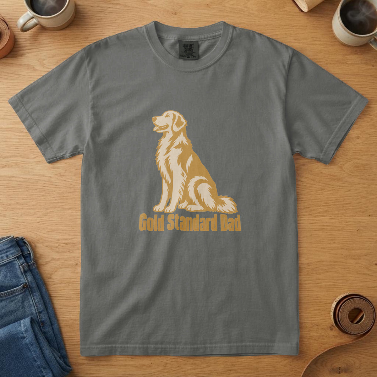Pepper t-shirt with a bone and mustard Golden Retriever illustration sitting in profile and the words "Gold Standard Dad"