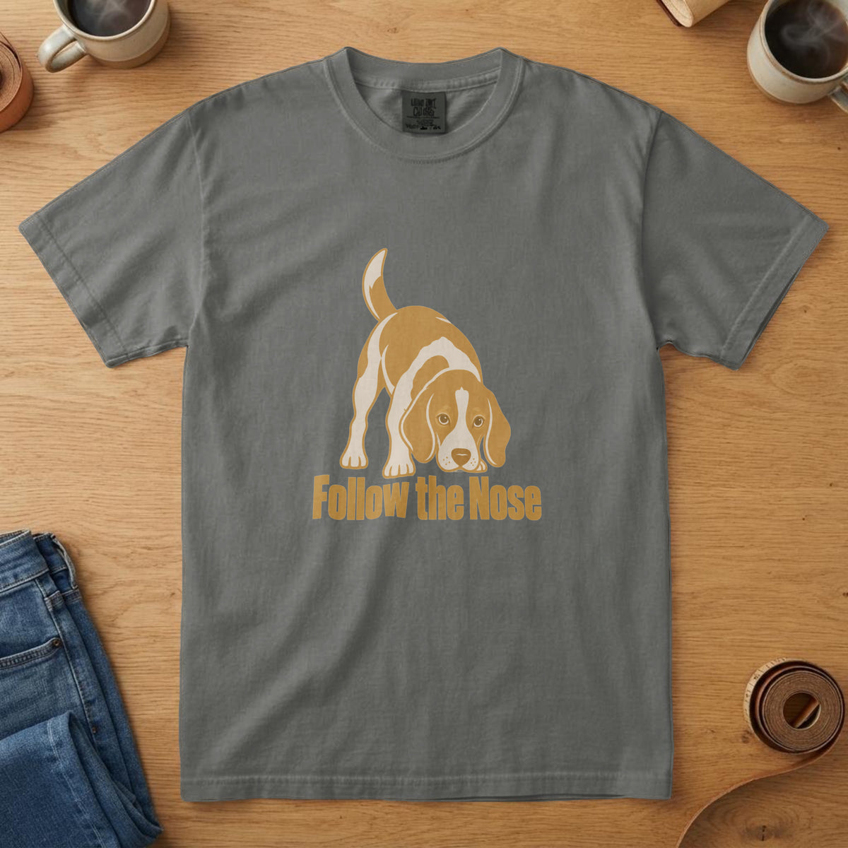 Pepper t-shirt with a bone and mustard Beagle illustration nose to ground tail up and the words "Follow the Nose"
