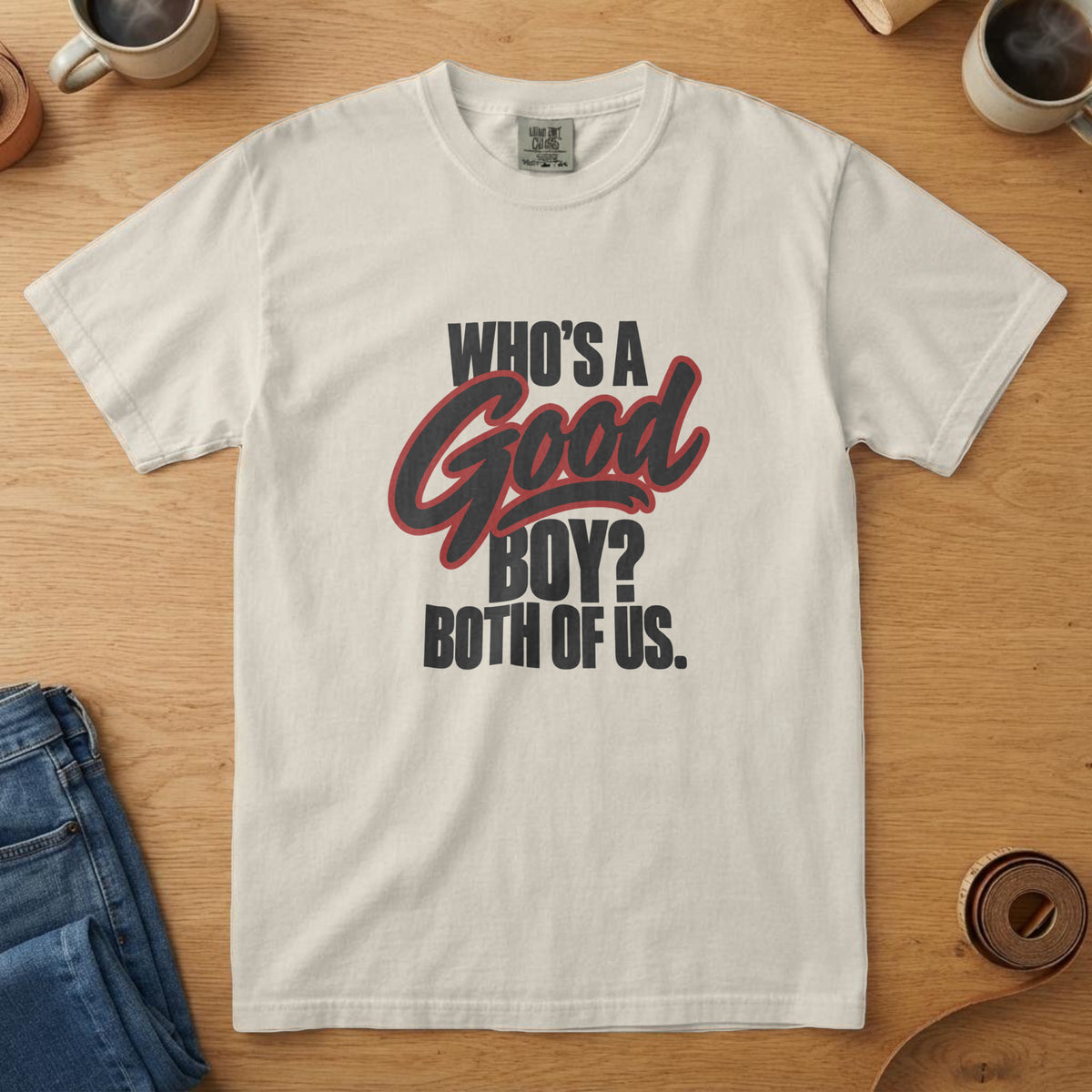 Ivory t-shirt with near-black and flag red script-pop lettering reading "Who's a Good Boy? Both of Us."